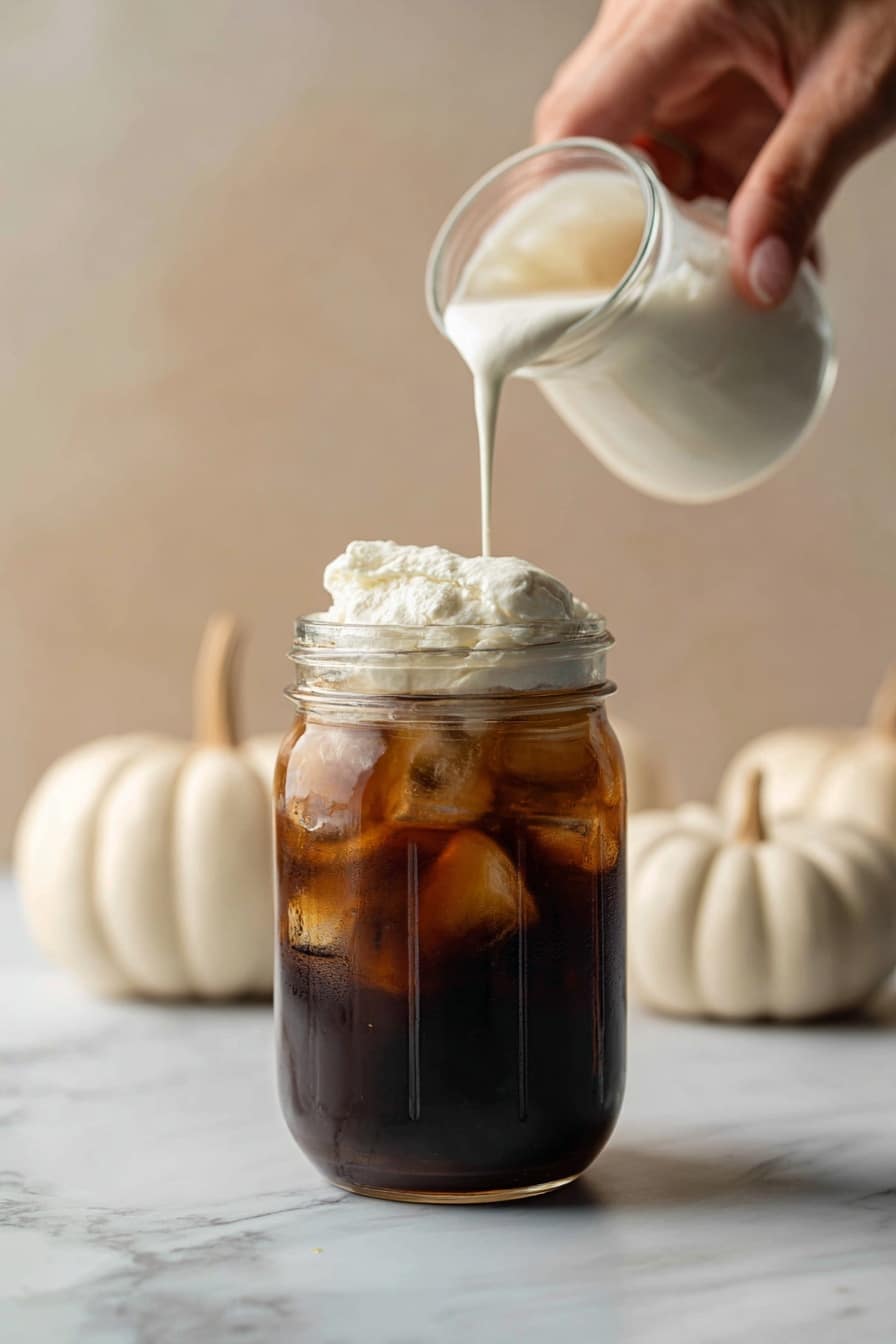 Ghost Cookies - Flat lay of rich black cocoa powder in a small heap, smooth unsalted butter partially melted with a glossy texture, light and dark brown sugar piled softly with crystalline texture, bright white granulated sugar sparkling under the light, fresh large whole egg and a separated golden egg yolk resting beside it, creamy white chocolate chips scattered delicately, and a small dollop of thick heavy cream with a silky surface, all arranged naturally with soft shadows and subtle highlights, placed on white marbled surface, photo taken with an iphone --ar 2:3 --v 7